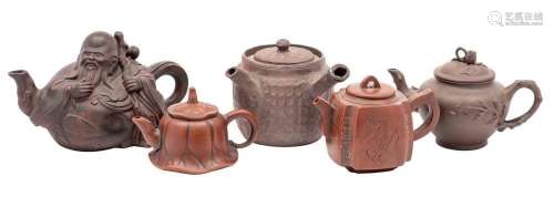 Five Chinese Yixing teapots, one in the form of the seated i...