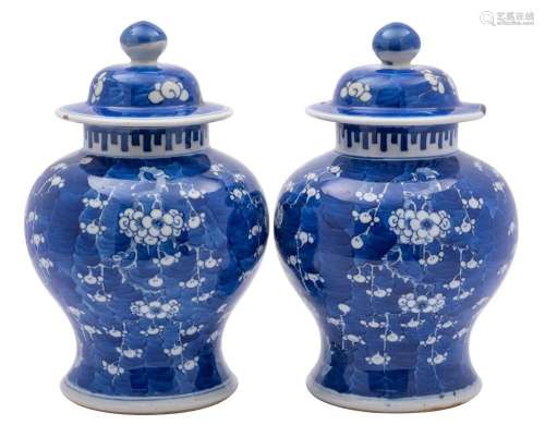 A pair of Chinese blue and white baluster jars and covers, l...