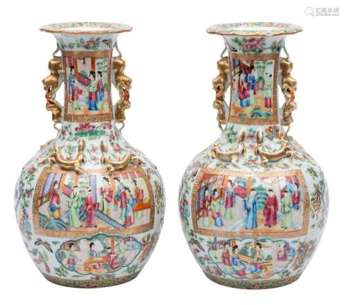 A pair of Canton baluster vases with shaped turnover rims an...