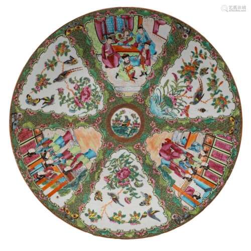 A Canton charger with small central bird and flower medallio...