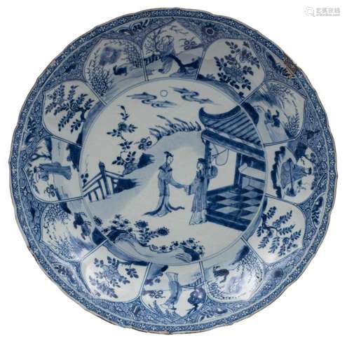 A Chinese blue and white lotus moulded dish painted with two...