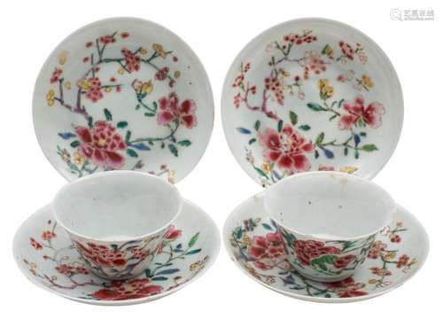 A pair of Chinese famille rose teabowls and saucers together...