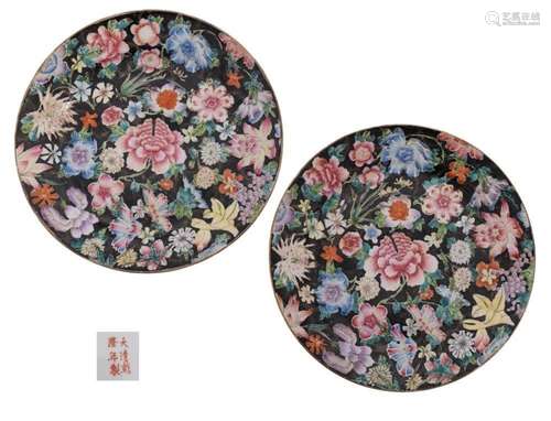 A pair of Chinese famille noire millefleurs plates painted w...