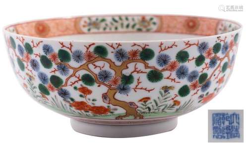 A Chinese porcelain bowl the exterior decorated with aged pi...