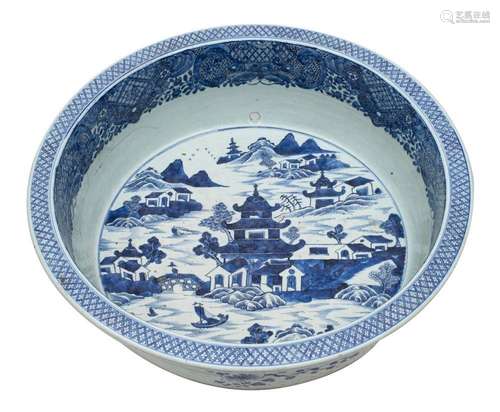 A large Chinese blue and white basin painted with an extensi...