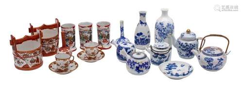 A group of Japanese porcelain, primarily blue and white, but...