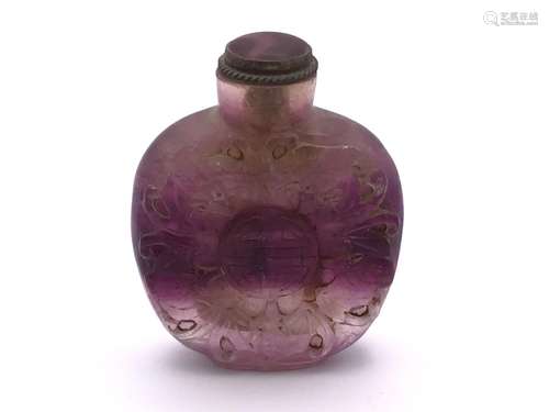 A carved amethyst rock crystal snuff bottle the de