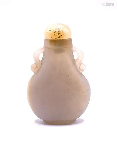 A carved pear shaped white agate snuff bottle with