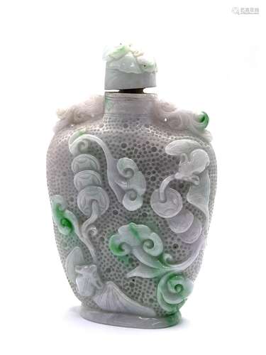 A large apple green and white finely carved jadeit