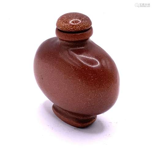 A modern polished goldstone snuff bottle. 6cm.