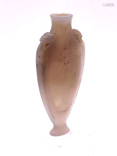 A finely carved elongated carved pale opalescent a