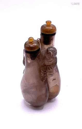 A small double carved rock crystal snuff bottle wi