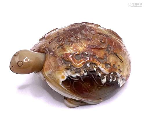 An unusual carved agate pebble in the form of a to