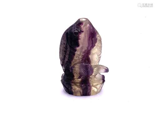 A carved amethyst crystal snuff bottle in the form