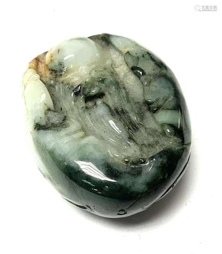 A carved jade pebble with a finely carved image of