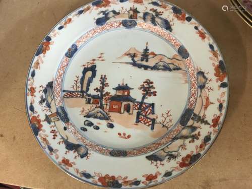 A Chinese Imari plate decorated with landscape vie