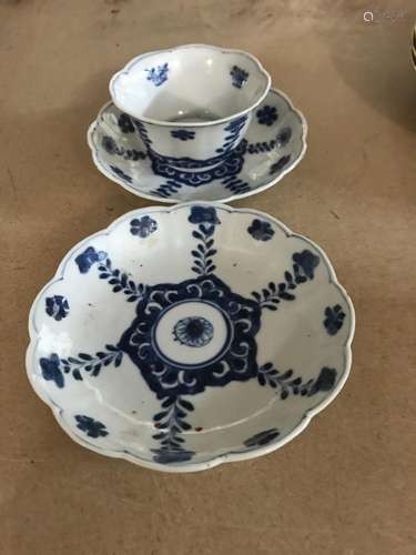 A Chinese tea bowl and saucer plus one other sauce