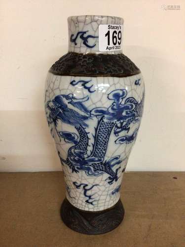 A Chinese crackle glaze vase decorated with dragon