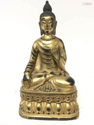 A gilt metal figure of a seated Buddha cast and wi