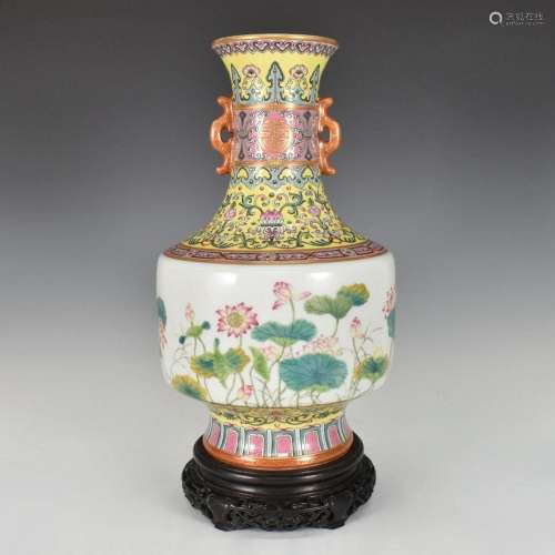 CHINESE FAMILLE ROSE LOTUS VASE WITH DOUBLE EARS AND WOOD ST...
