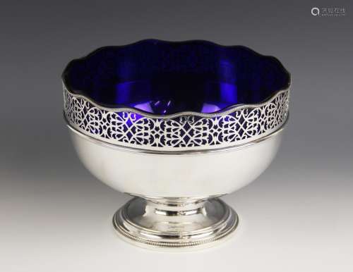 A silver plated fruit bowl, of circular form with pierced sc...