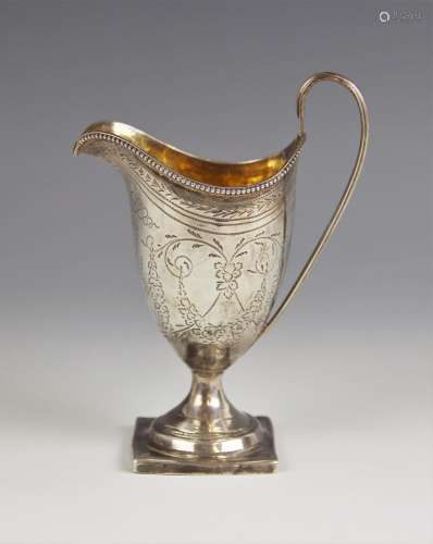 A George III silver cream jug, London 1796, of helmet form o...