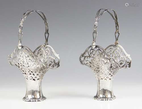 A pair of George V silver swing handled baskets, Henry Matth...