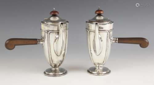 A pair of George V silver side pouring chocolate or coffee p...