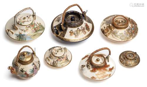 A GROUP OF SEVEN JAPANESE SATSUMA SMALL OR MINIATURE WINE PO...