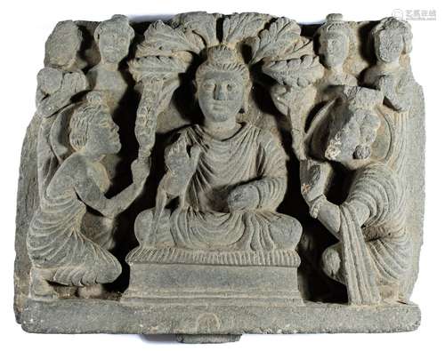 A GANDHARA GREY SCHIST RELIEF DEPICTING THE FIRST SERMON, NO...