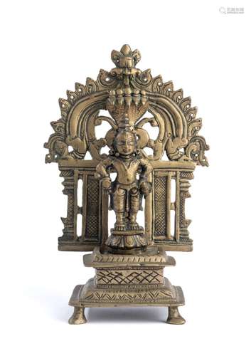 A BRONZE FIGURE OF VITHOBA IN A SHRINE, WESTERN DECCAN, INDI...