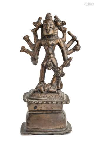 A FOLK BRONZE FIGURE OF DURGA SLAYING THE BUFFALO DEMON, WES...