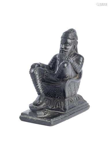 A SMALL BLACK STONE CARVING DEPICTING RANJIT SINGH, NORTHERN...