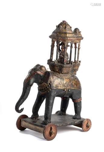 A PAINTED AND CARVED WOOD TOY ELEPHANT, INDIA, LATE 19TH CEN...