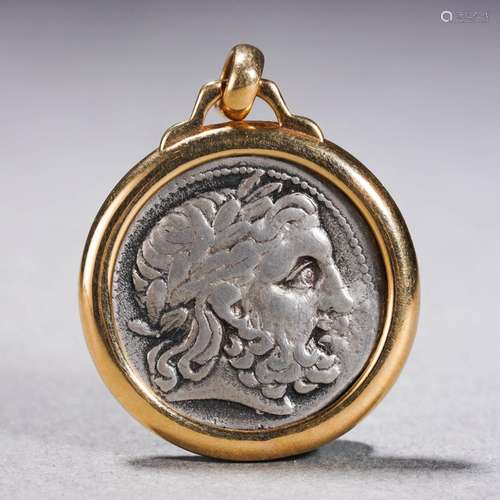 A Gold Mounted Silver Coin Pendant