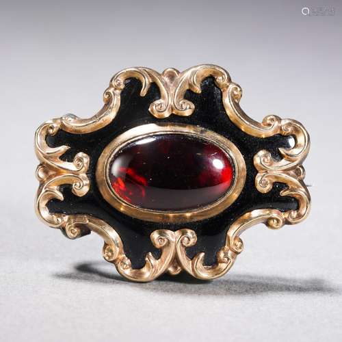 A 9 Karat Gold Garnet Brooch