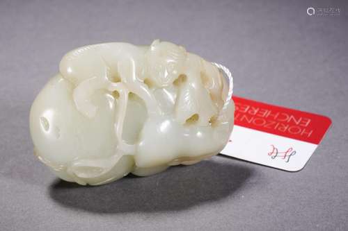 A Carved White Jade Monkey with Mellons