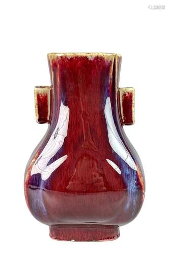 Red-glazed kiln-shaped bottle with pierced ears