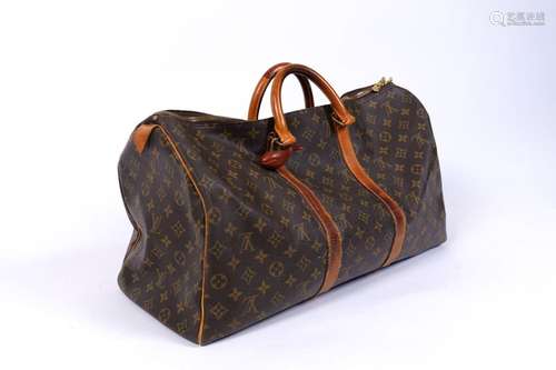 VUITTON : SAC besace en cuir et toile enduite siglée (usures...