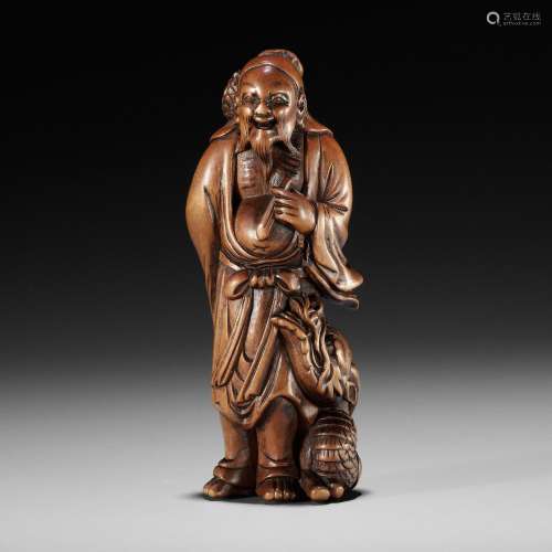 AN EXCEPTIONAL AND RARE WOOD NETSUKE OF RYO TOHIN TAUNTING A...