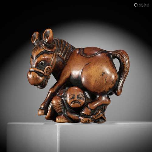 A SUPERB WOOD NETSUKE OF A MULE AND GROOM