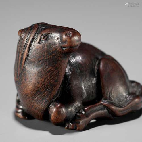 【†】 MASAMARU: A FINE WOOD NETSUKE OF A RECUMBENT HORSE