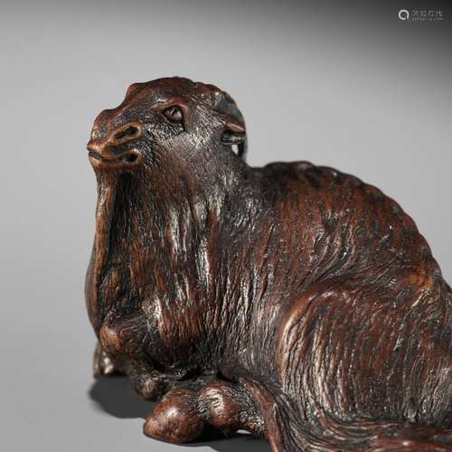 【†】 MASAYASU: A FINE WOOD NETSUKE OF A RECUMBENT GOAT