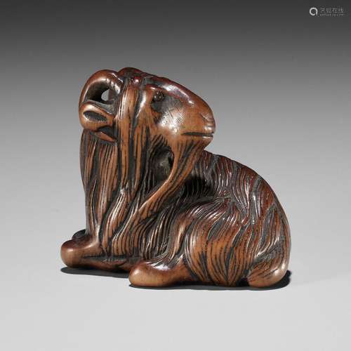 【†】 A FINE WOOD NETSUKE OF A GOAT