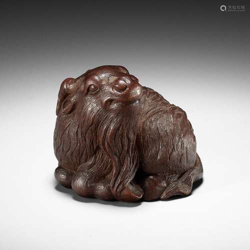 ITTAN: A FINE WOOD NETSUKE OF A SHAGGY GOAT