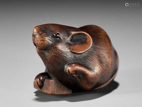 IKKAN: A FINE WOOD NETSUKE OF A RAT WITH A SHOGI TILE