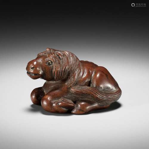 MINKO: A SUPERB WOOD NETSUKE OF A RECUMBENT HORSE