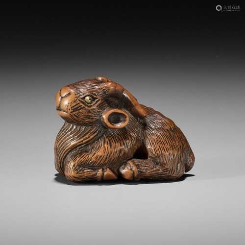 【†】 MINKO: A WOOD NETSUKE OF A RECUMBENT GOAT