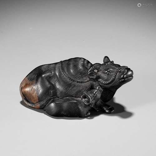 【†】 HARITSU: AN EBONY NETSUKE OF AN OX AND CALF