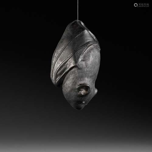 A RARE EBONY NETSUKE OF A BAT